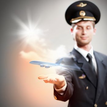 Image of pilot with airplane taking off from his hand