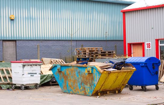 rubbish and trash in and around a skip