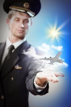 Image of pilot with airplane taking off from his hand