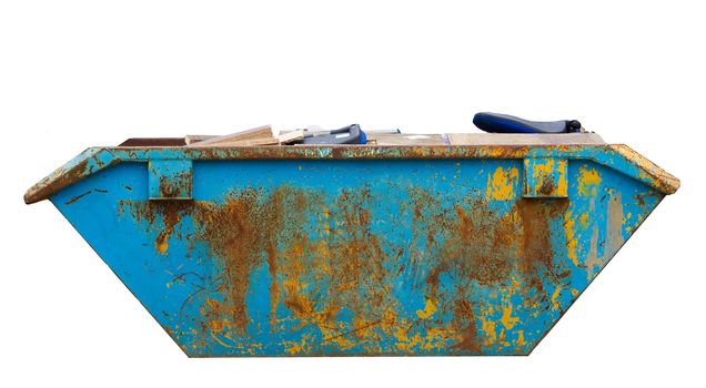 rubbish and trash in and around a skip isolated
