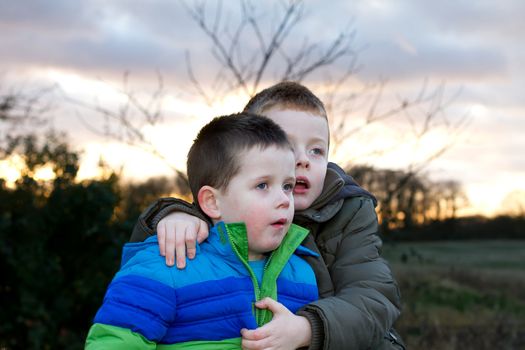 frightened boys looking upwards