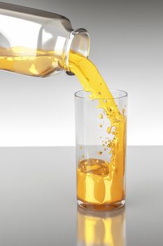 An image of orange juce bottle onad glass