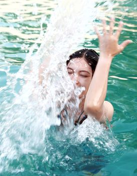 woman playing in the swimming pool