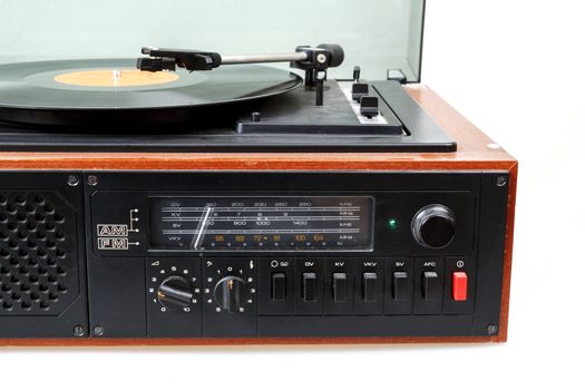 Detail of vintage radio gramophone player with vinyl