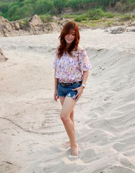 a portrait of beautiful woman on the sand