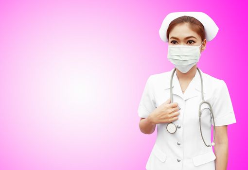 female nurse with stethoscope on pink background