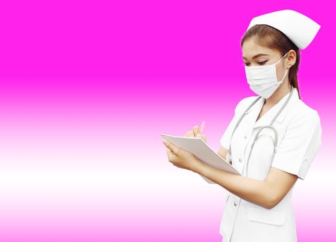 Asian female nurse writing medical report on pink background