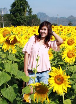 Women in the field of sunflowers
