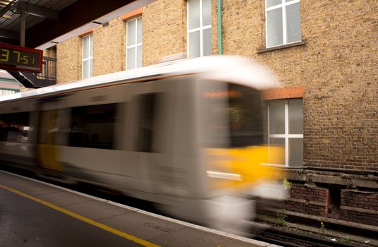 Train entering a station, with motion blur.