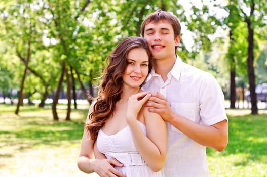 couple hugging in the park, have a good time together