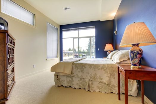 Bedroom interior with blue wall and asian lamps.