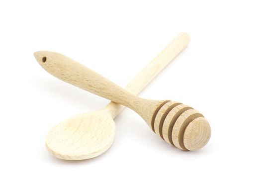 Wooden honey dipper and spoon isolated on white background 