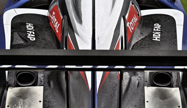 Peugeot endurance racing car detail after rain