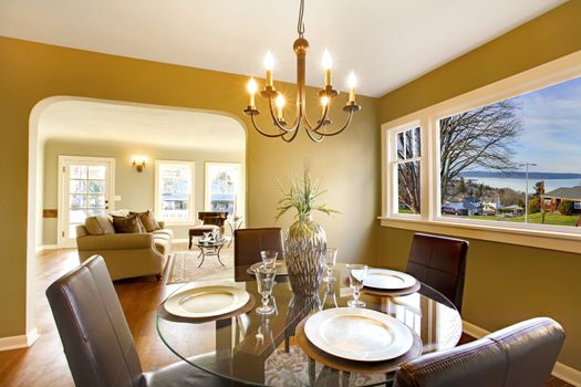 Green interior with dining room with living room