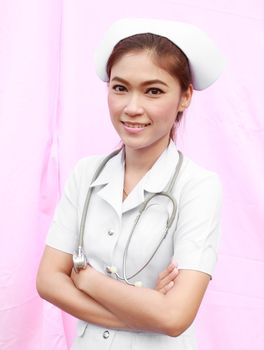 Female nurse standing with stethoscope