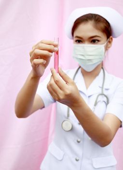 Female nurse with test tube