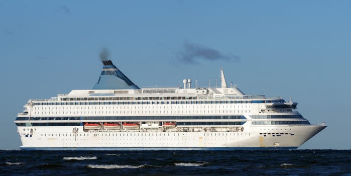 White passenger ferry on a background of the blue sky