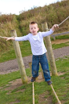 little boy playing at the park