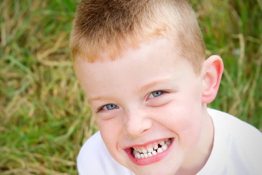 little boy smiling in the evening Autumn sun