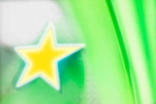 yellow star on green background