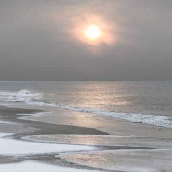 atmospheric wintersun at the northsea