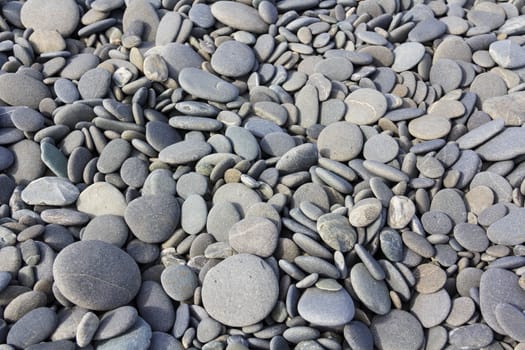 gray sea pebbles texture near the ocean