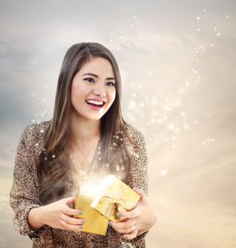 Girl Opening a Magical Golden Gift Box 