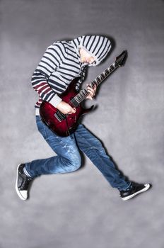 passionate guitarist jumps in the air