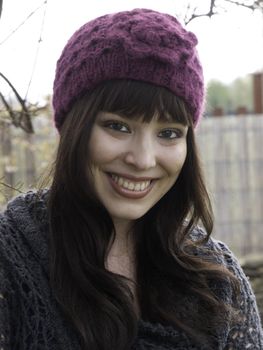 Pretty young woman in pink wooley hat