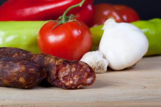 Sausage with vegetables in the back