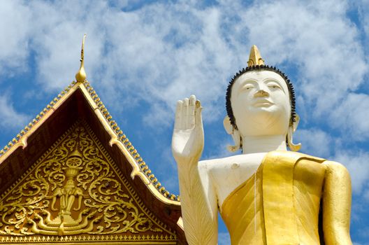 Buddhist temple and Buddha statue in Vientiane, Laos.