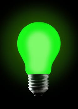 Green light bulb on black background.