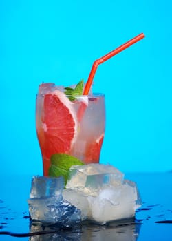 Mojito grapefruit  cocktail.on blue background. close up