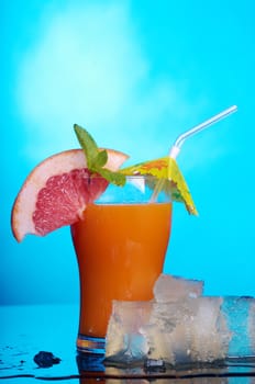 tropical coctail drink with ice cubs,closeup