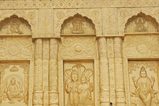 Durgiana Hindu Temple. Detail of ornate gold panel and inlaid mable decorating the front of a hindu temple. Amritsar, Punjab, India