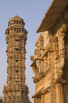 Ornate carved stone victory tower (Vijay Stambha) built to celebrate an ancient victory. Chittaugarh, Rajasthan, India.