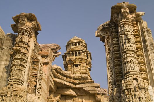 Ornate carved stone victory tower (Vijay Stambha) built to celebrate an ancient victory. Chittaugarh, Rajasthan, India.