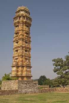Ornate carved stone victory tower (Vijay Stambha) built to celebrate an ancient victory. Chittaugarh, Rajasthan, India.