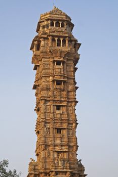 Ornate carved stone victory tower (Vijay Stambha) built to celebrate an ancient victory. Chittaugarh, Rajasthan, India.