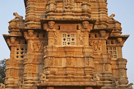 Detail of ornate carved stone tower built to celebrate an ancient victory. Chittaugarh, Rajasthan, India