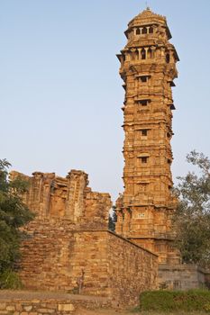 Ornate carved stone victory tower (Vijay Stambha) built to celebrate an ancient victory. Chittaugarh, Rajasthan, India.