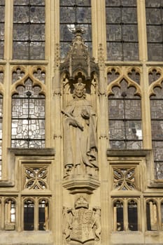 Detail of religious statue on the west front of Bath Abbey. 16th Century church, Bath, England, United Kingdom