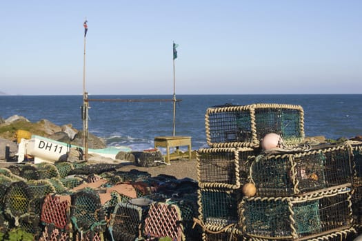 Lobster pots in the coastal fishing village of Beesands in Devon, England