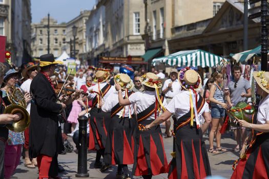 Female Morris Dancers performing in Bath, Somerset, England as part of the St Georges Day celebrations.