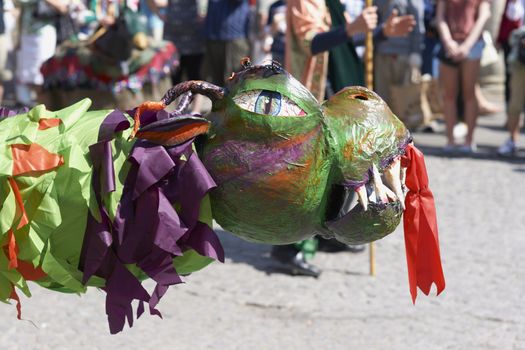Street artists re-enacting the story of St George and the dragon in Bath, Somerset, England as part of the St Georges Day celebrations.
