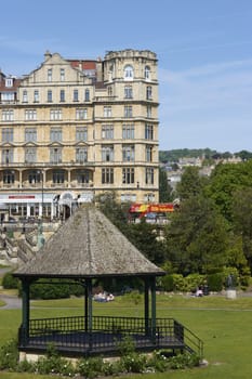 Band stand in Parade Gardens in Bath, Somerset, England. Empire Hotel in the background.