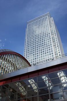 Modern office building towers above the Docklands Light Railway Station at Canary Wharf, London, England