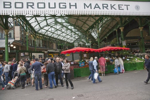 Crowds of at the historic Borough Market in Southwark, London, England.