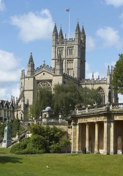 Bath Abbey standing tall above Parade Gardens in Bath, Somerset, England