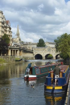 Canal boats on the River Avon in Bath, Somerset, England